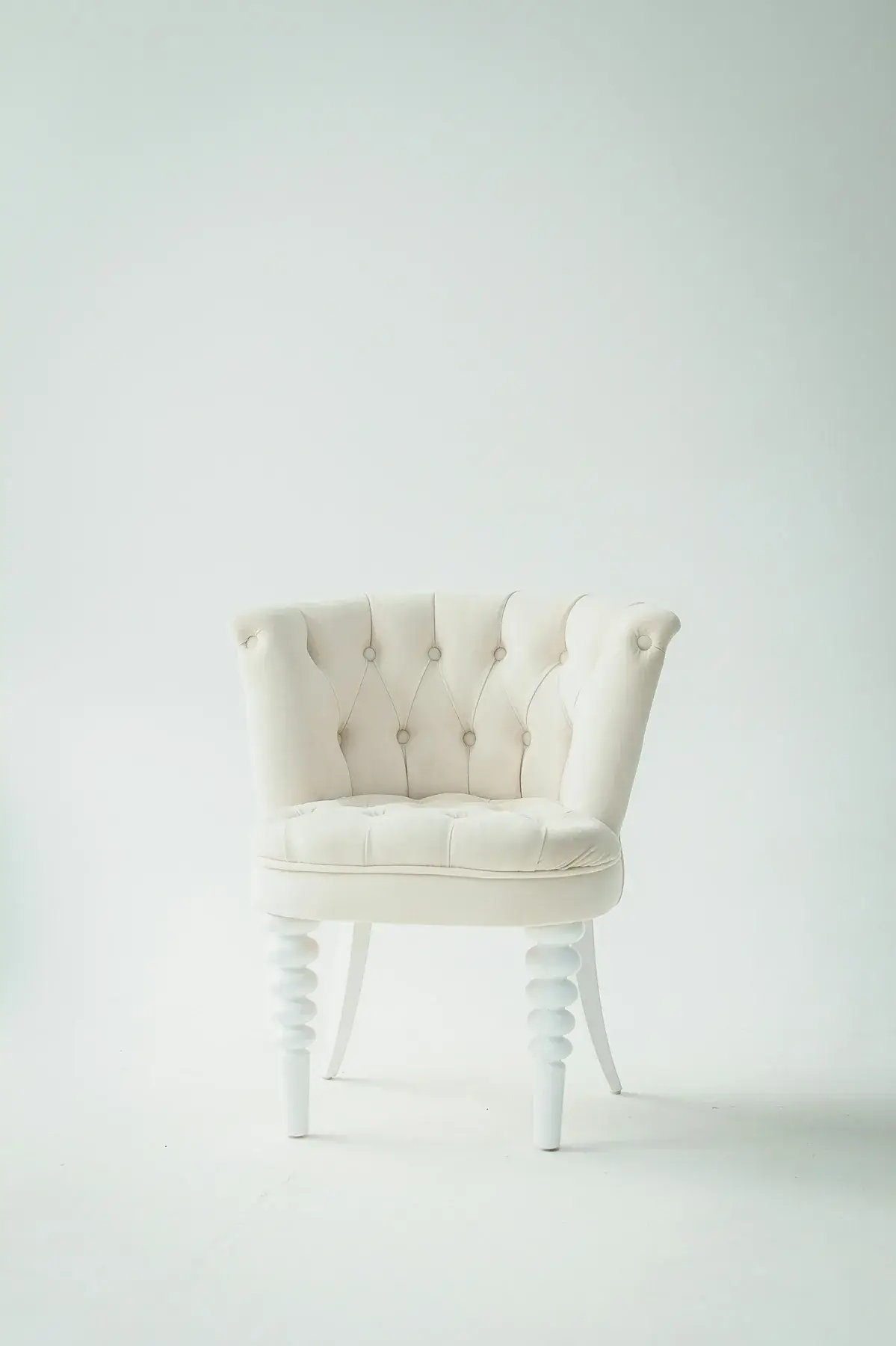 White tufted accent chair